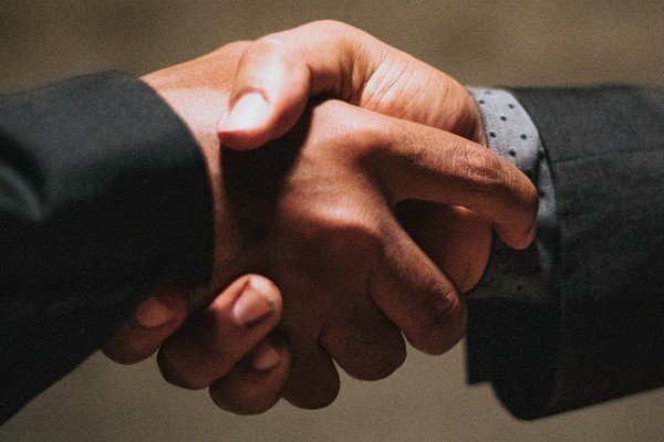 Close-up of two businessmen shaking hands